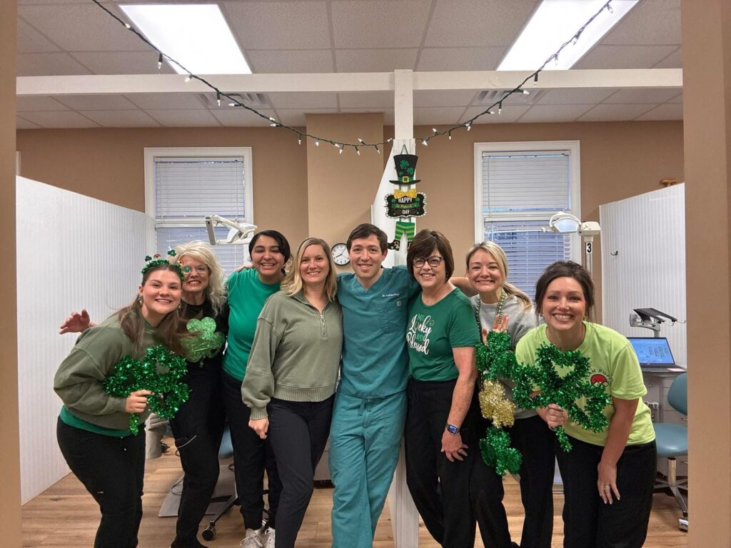 The Team Popp team wearing green in the clinic